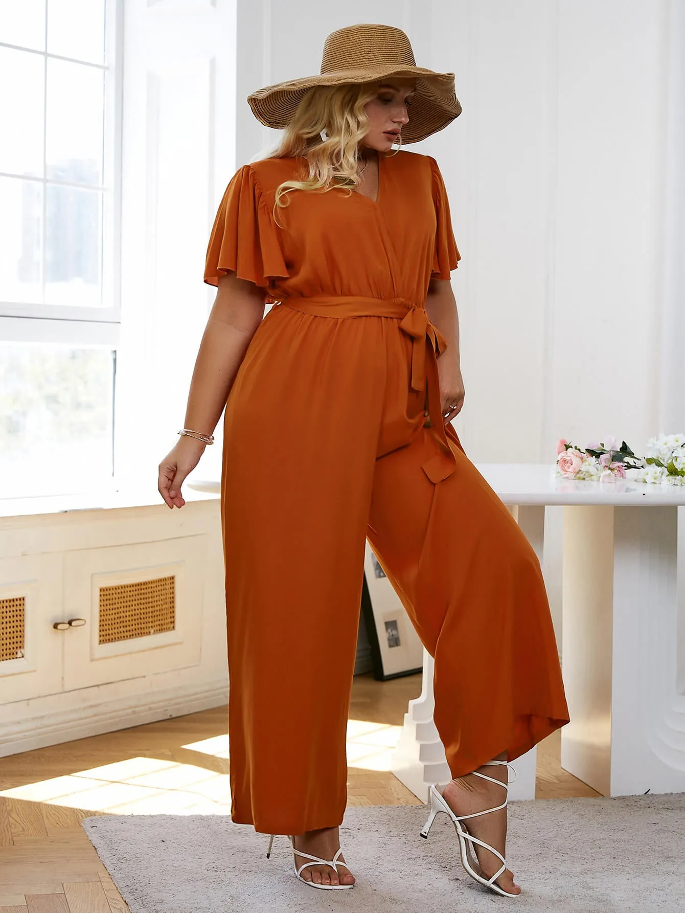 Plus Size Flutter Sleeve Belted Surplice Jumpsuit